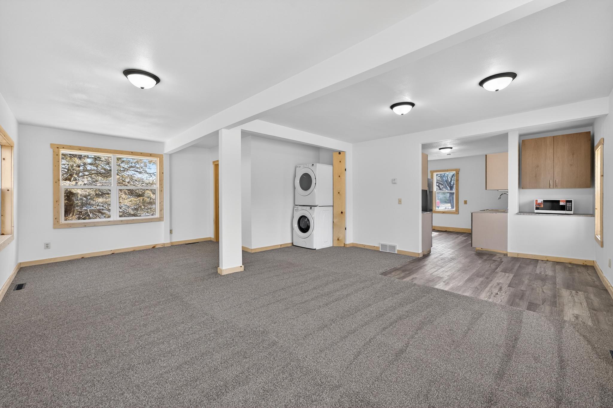 Laundry is located in the corner - new stackable washer and dryer