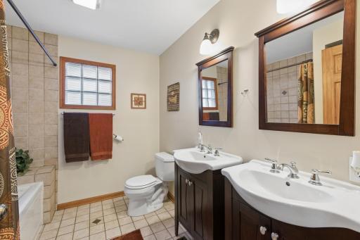 The main floor full bath features dual sinks, tile floors and a jetted tub. This home is ready for you to move in and start enjoying the beautiful wildlife, tranquil waters of Pickeral Lake and everything the Heart of the Lakes area has to offer.