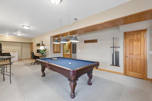 As you head down the stairs to the walkout lower level you are greeted by an open space that can be a large living room or a rec-room.