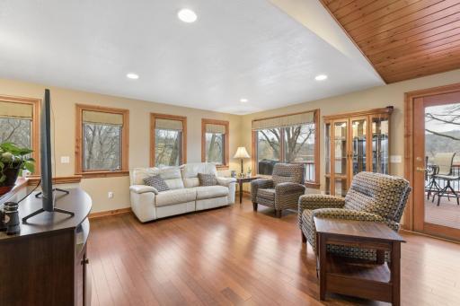 The spacious living room flows nicely with the open concept of the main floor of the home and out to the lakeside deck. This home was truly built with the lake in mind with its oversized picture windows throughout.