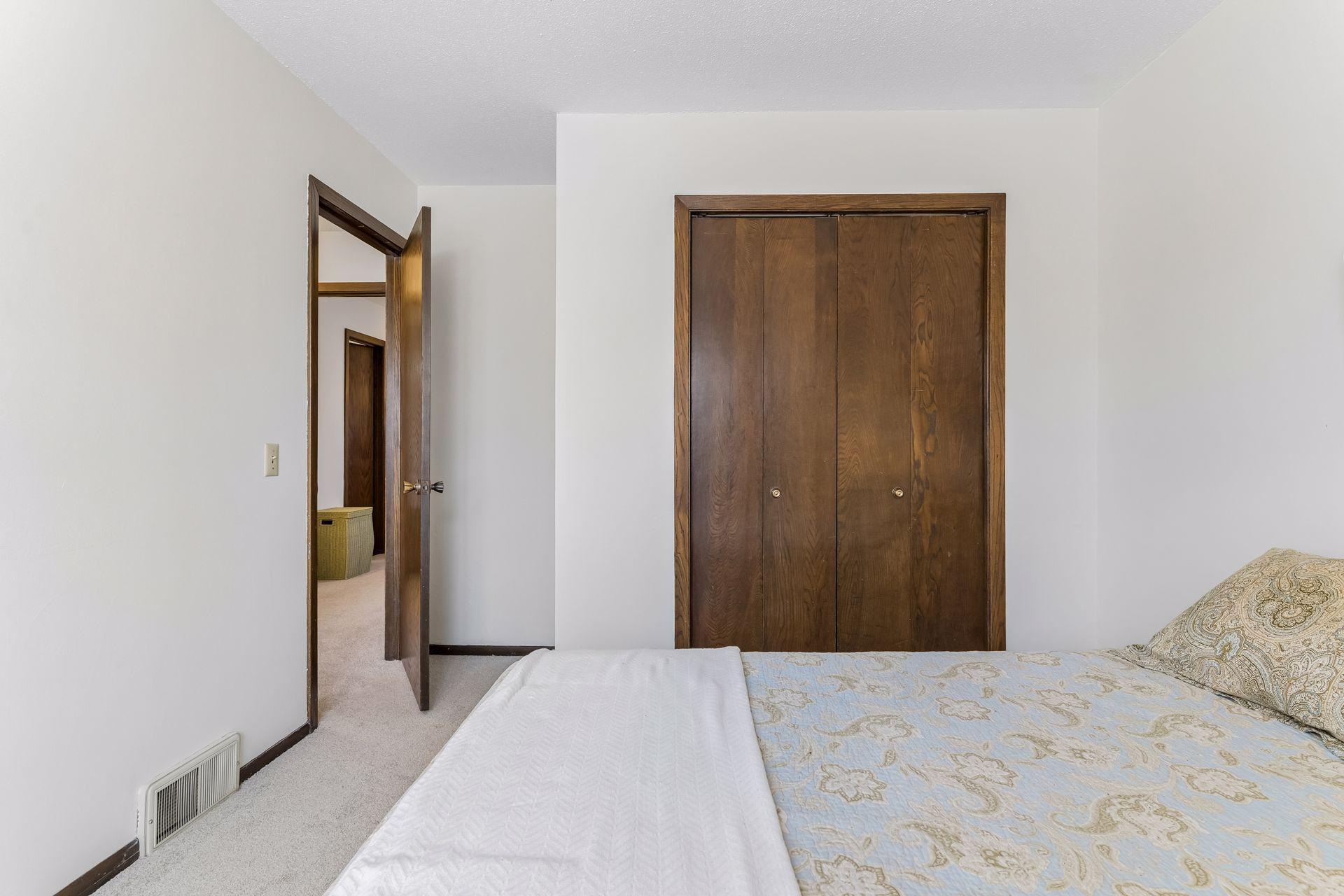 Additional view of second bedroom highlighting closet space and clean, neutral finishes.