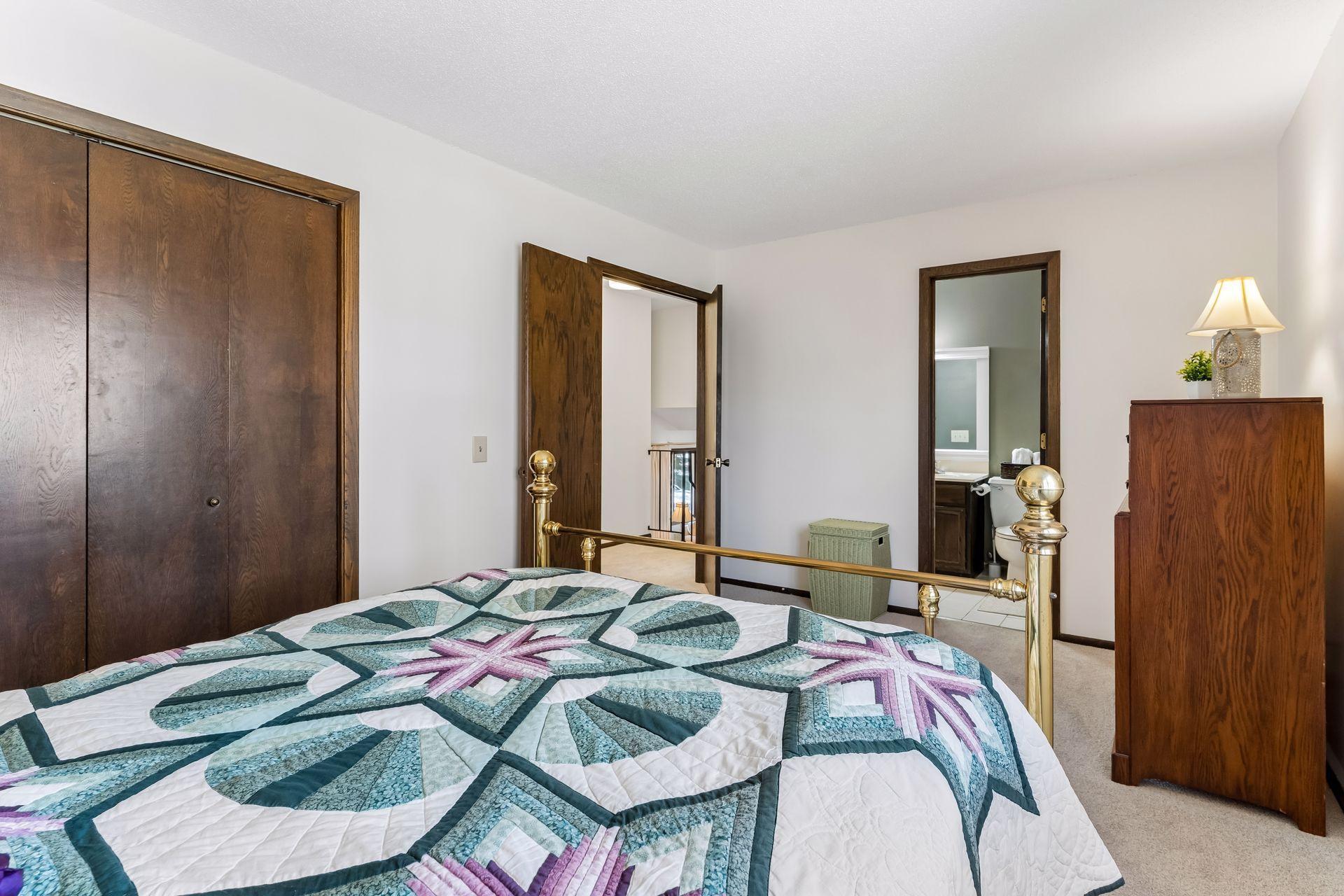 Additional view of primary bedroom showcasing generous space, closet access and connection to upper-level full bathroom.