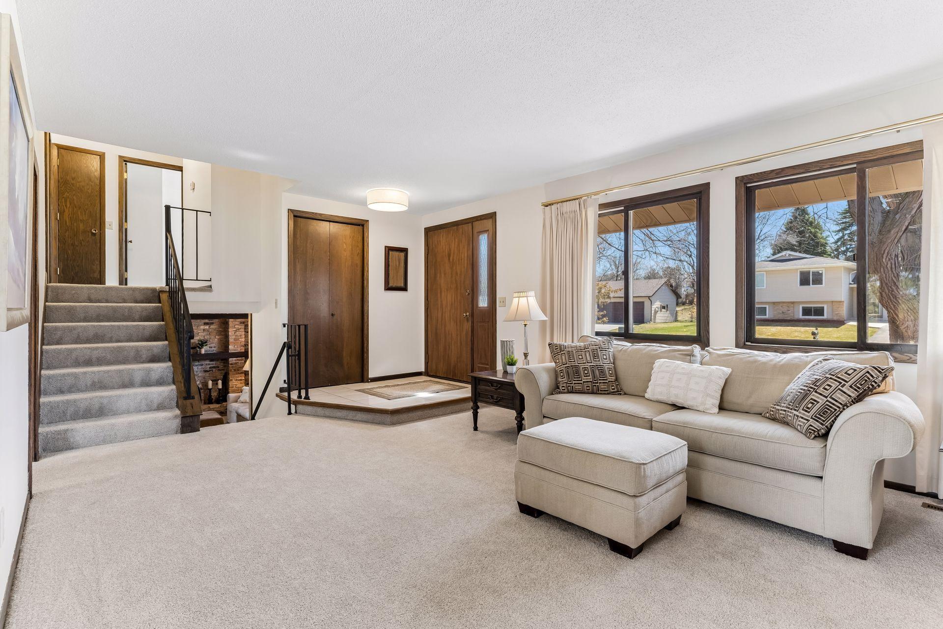 Open main living space with functional layout, new carpet, and flexible design, perfect for modern living, gatherings, and comfortable everyday use.