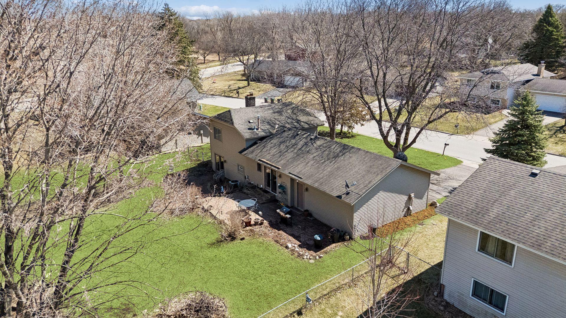 Aerial view of property highlighting lot size, backyard space, and surrounding neighborhood.