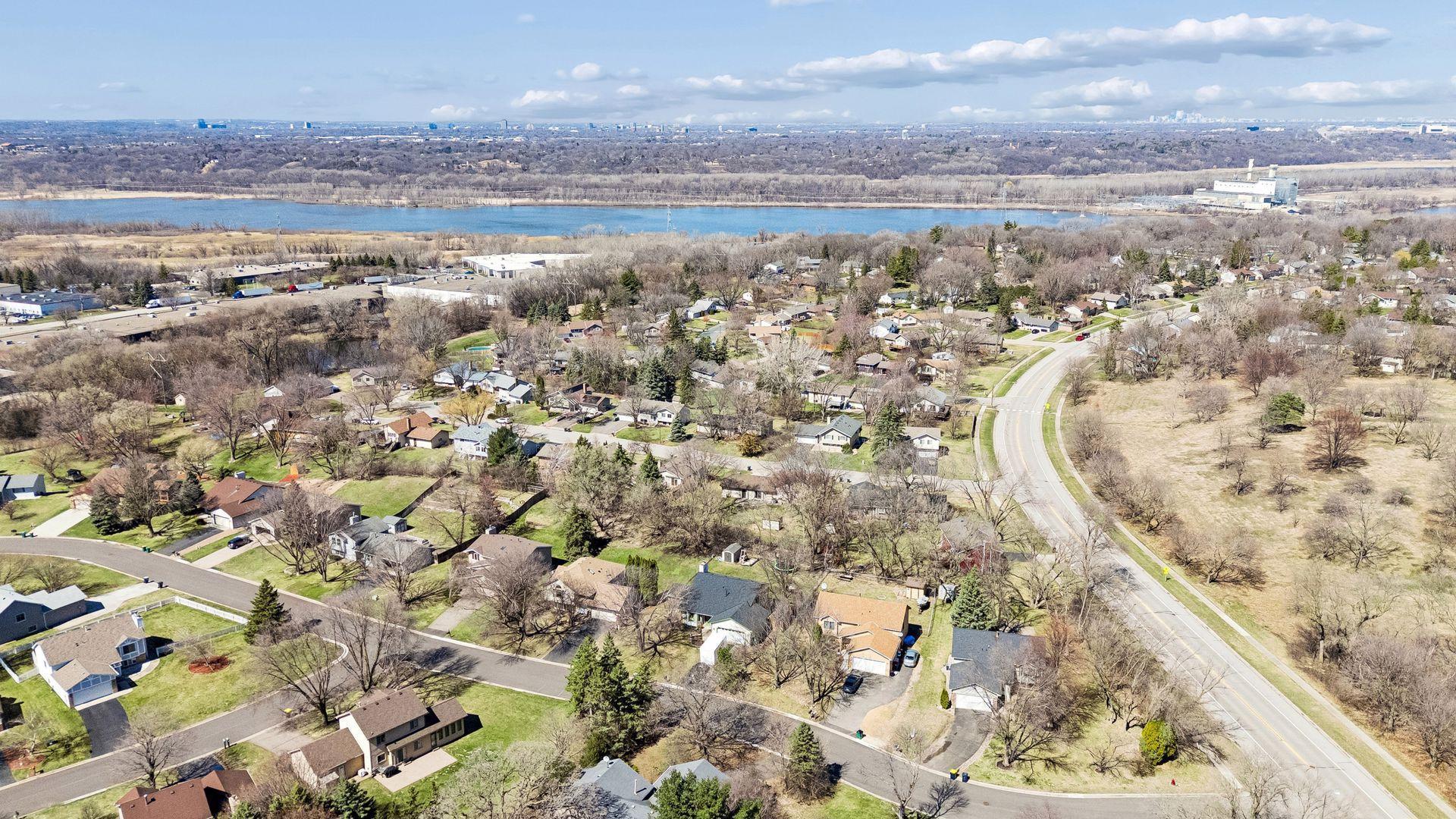Aerial neighborhood view showing proximity to nearby parks, green space, and residential setting.