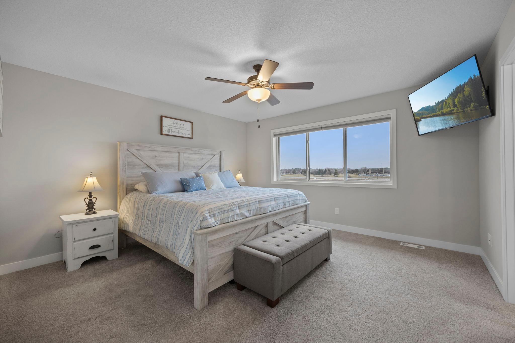 Primary Suite with natural light, walk-in closet and private ensuite!