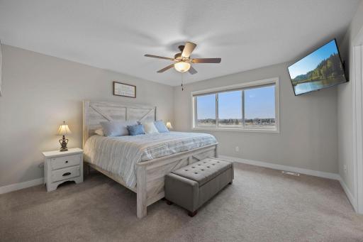 Primary Suite with natural light, walk-in closet and private ensuite!