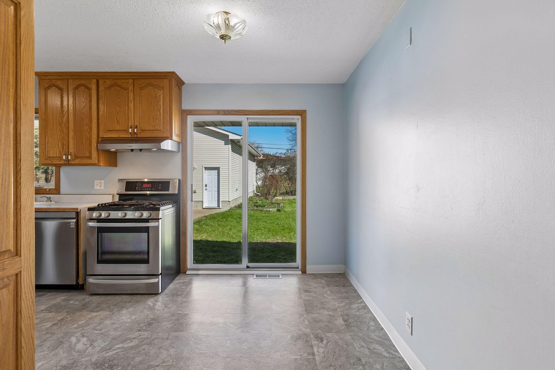 Step into the dining area. The patio doors here lead out to the backyard.