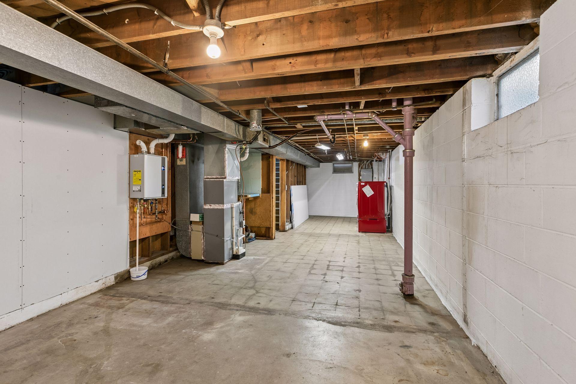 Part of the lower level is unfinished, you could add a bath here, or use if for so much storage.