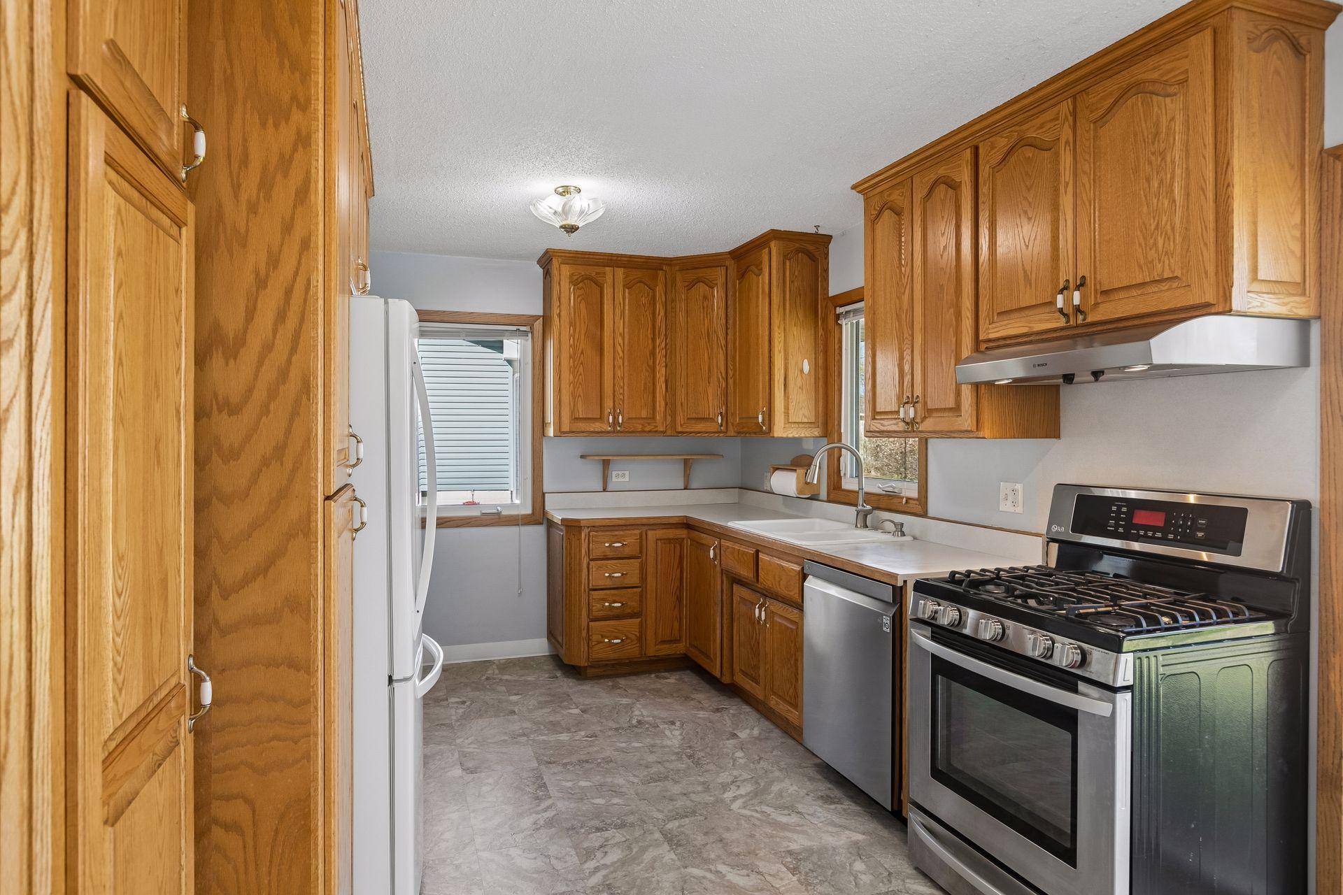 Note all of the counterspace and stainless steel appliances.