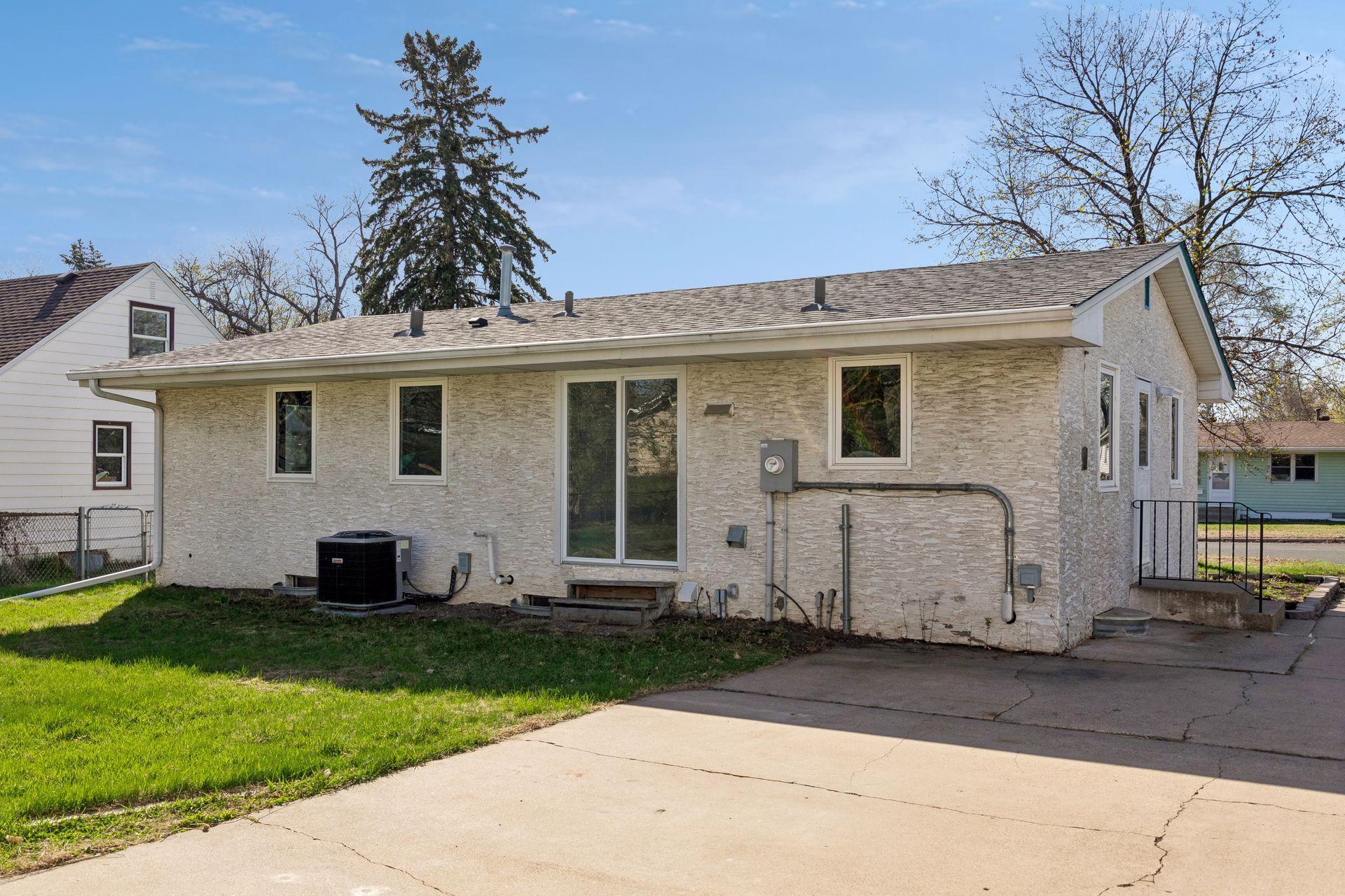 The patio doors lead out to your yard, and oversized driveway.