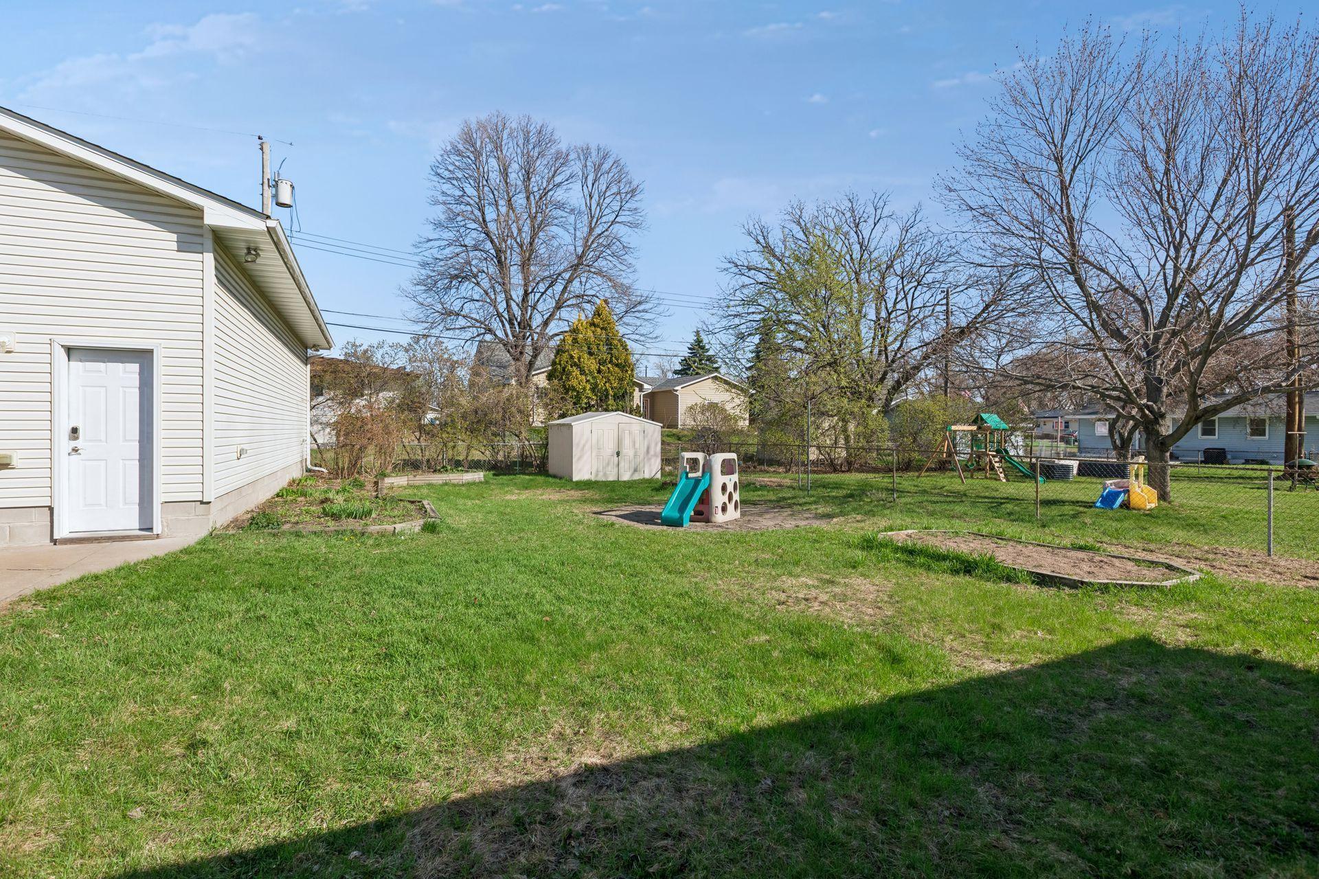 The yard is partially fenced.