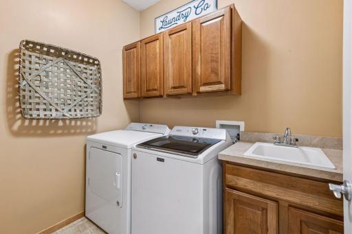Handy laundry space closes off so you don't have to walk-thru the laundry when you arrive home. Great space.
