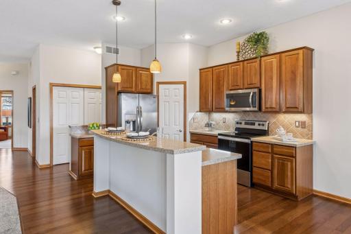Kitchen features a raised snack bar, perfect for hiding your mess while offering nice function as a breakfast bar.