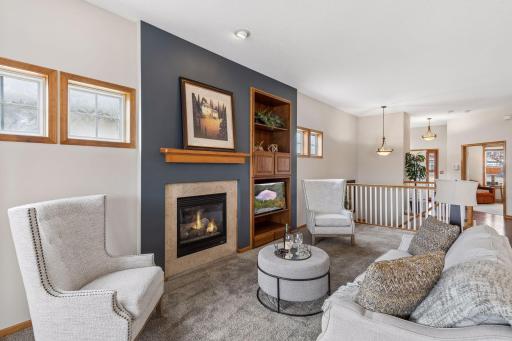 Living room view toward stairwell and foyer.