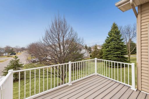 Maint. free deck overlooks green space and mature trees.