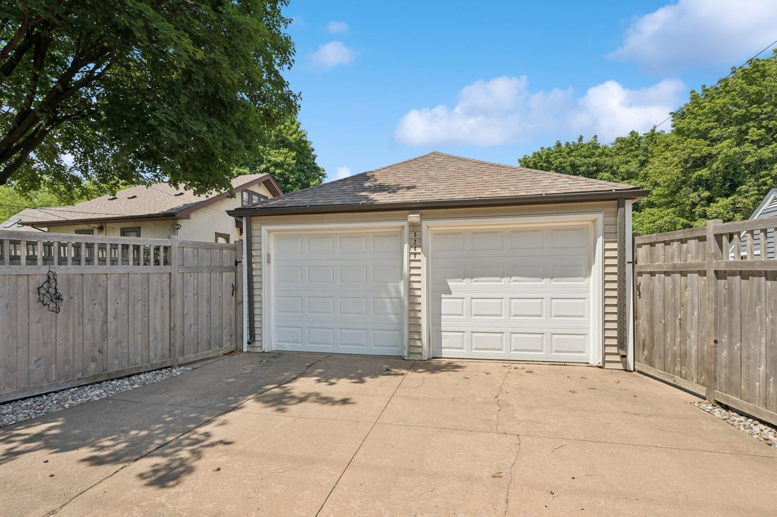 The large 2 car garage has a concrete driveway and is conveniently connected to the house.