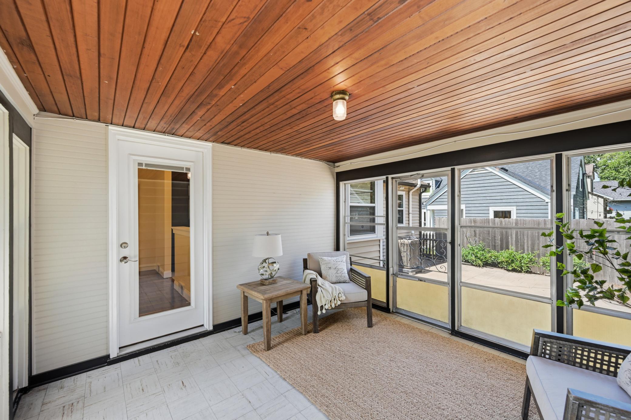 A convenient sun porch connects the garage to the house.