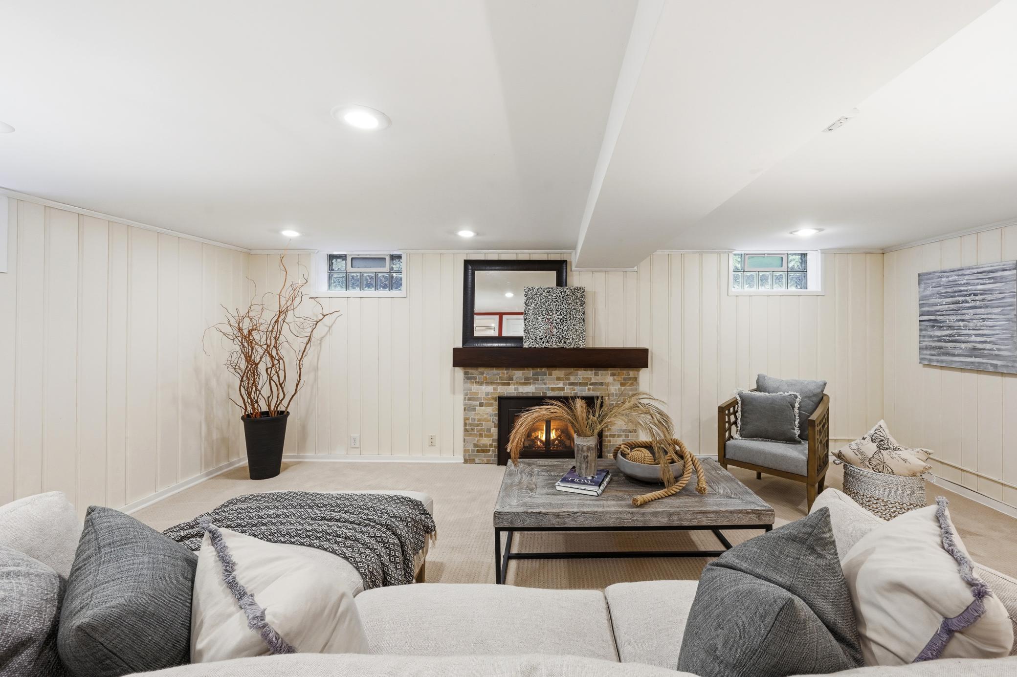 Spacious lower level family room with gas fireplace.