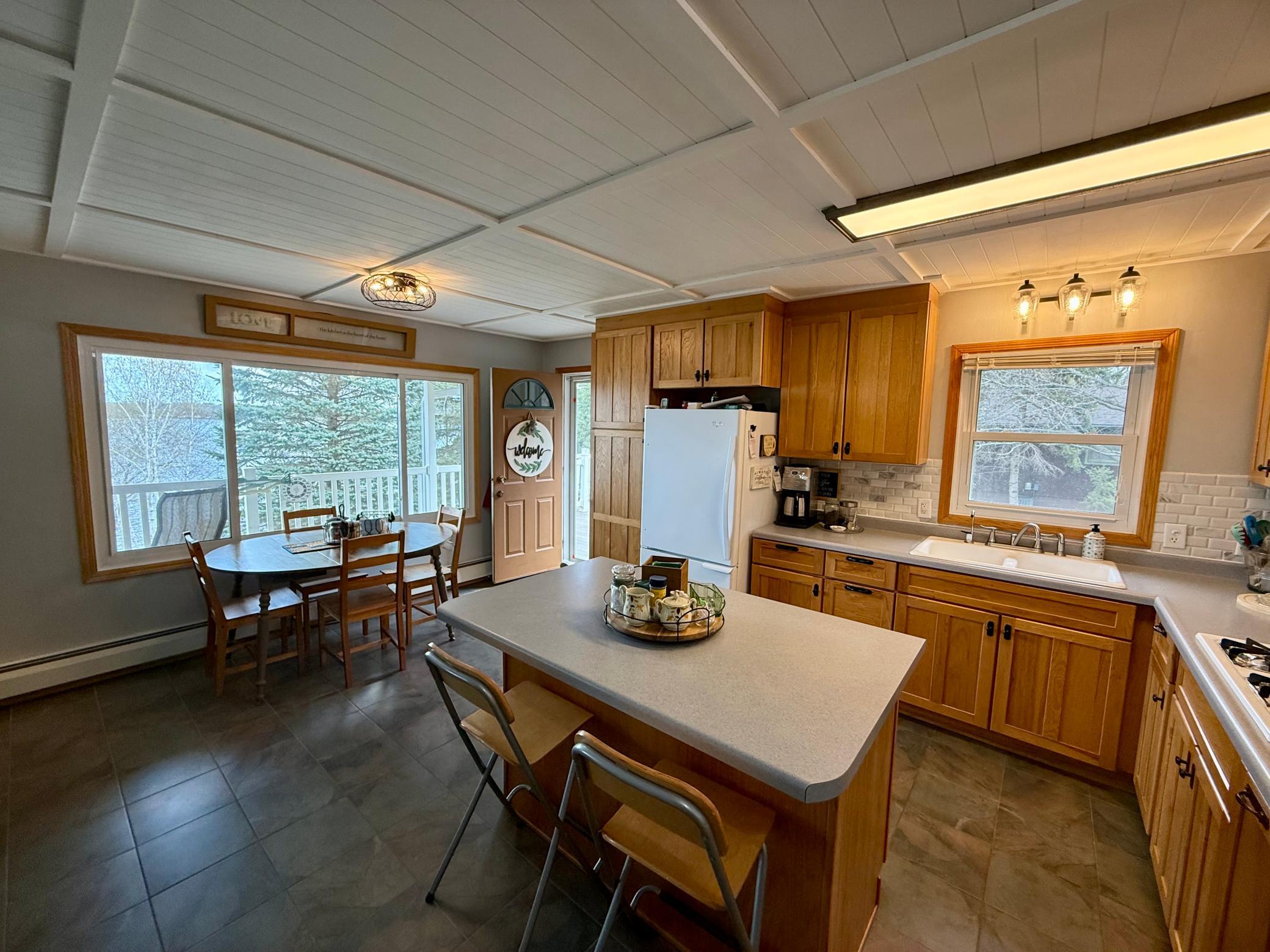 Spacious, inviting kitchen with a large island and open dining area-perfect for entertaining.