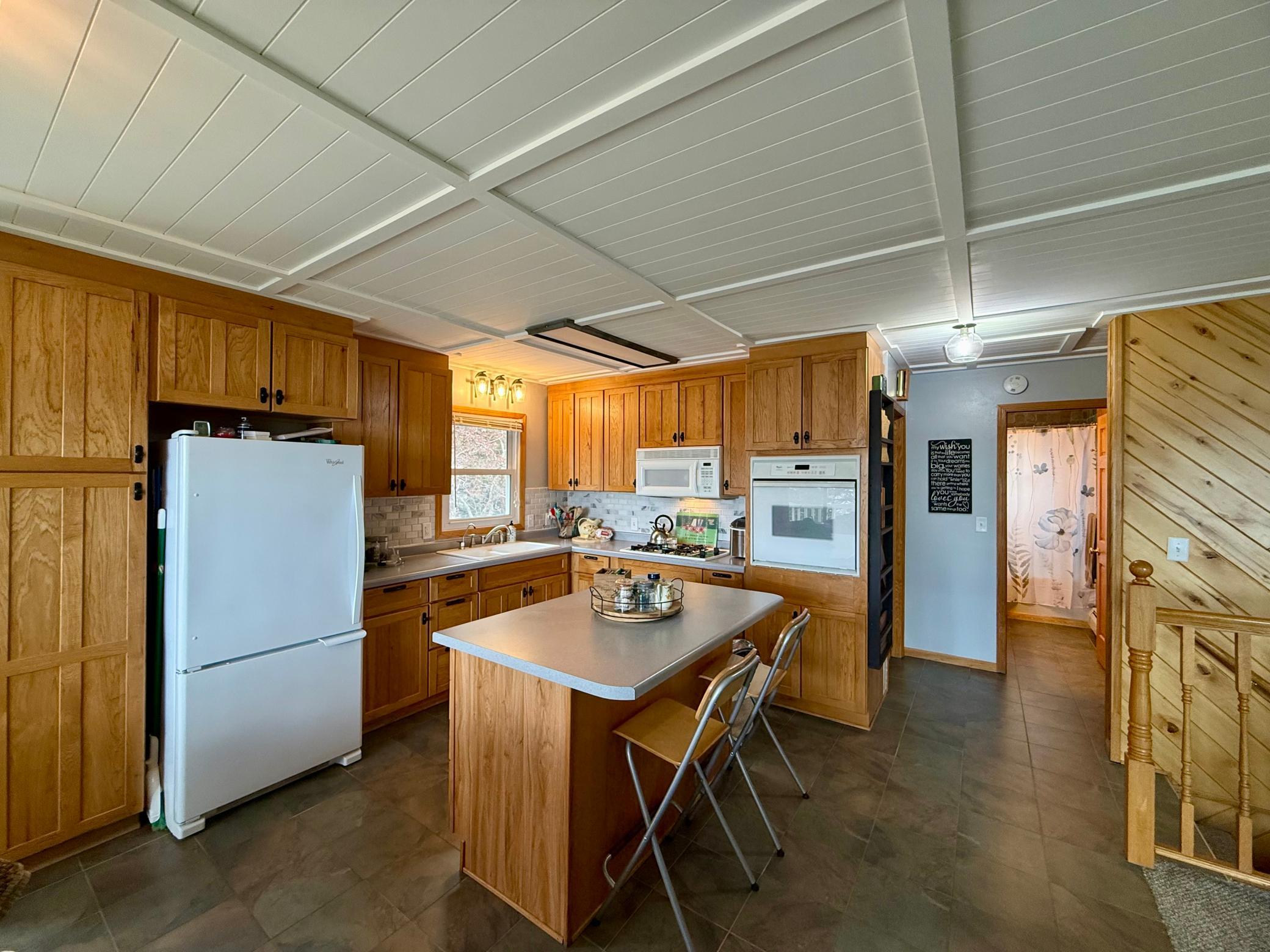 The dishwasher is on the backside of the island. Everything you need for easy lake living!