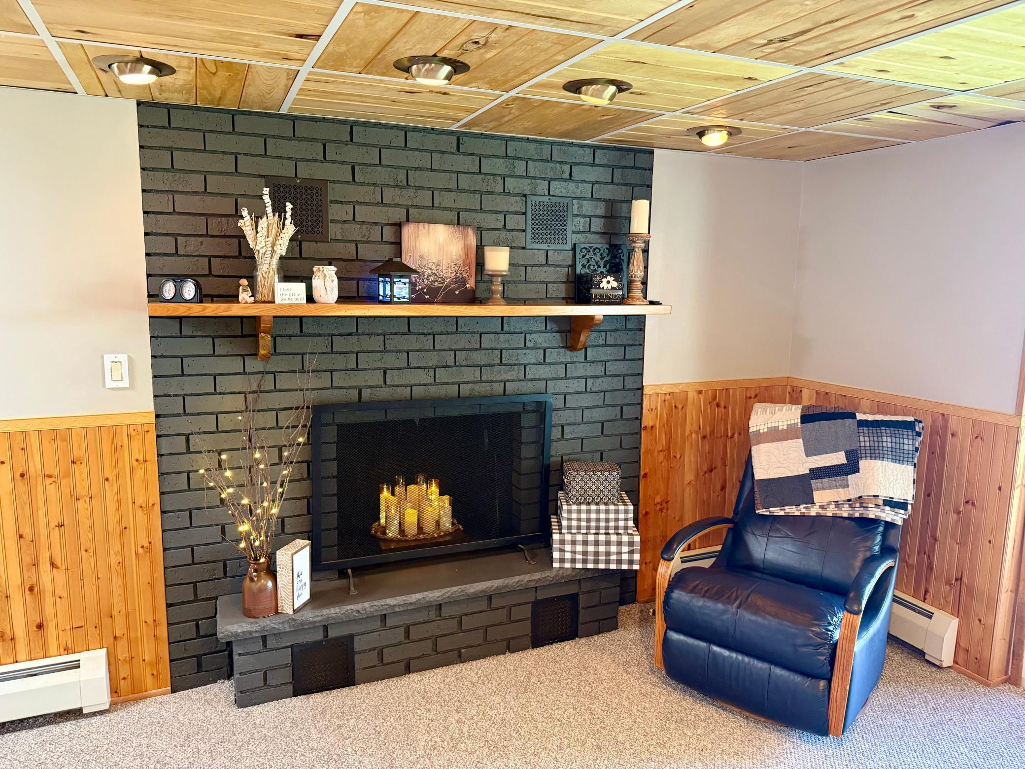 Beautiful brick fireplace, creates a warm and inviting ambiance on those chilly winter nights in, cozying up with a book or a great movie.