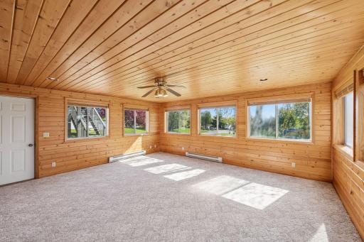 Enjoy views of backyard and access to patio from 4 Season Sunroom