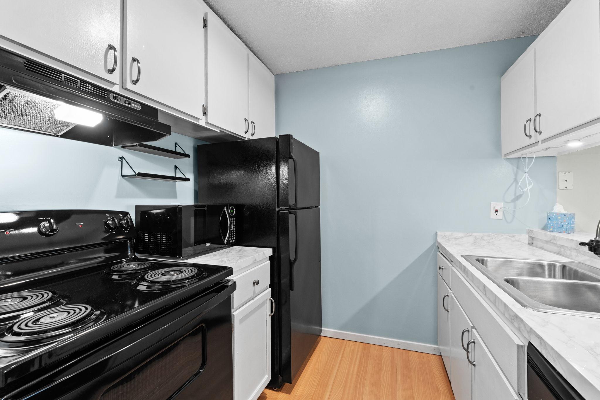 Functional kitchen opens to the living room