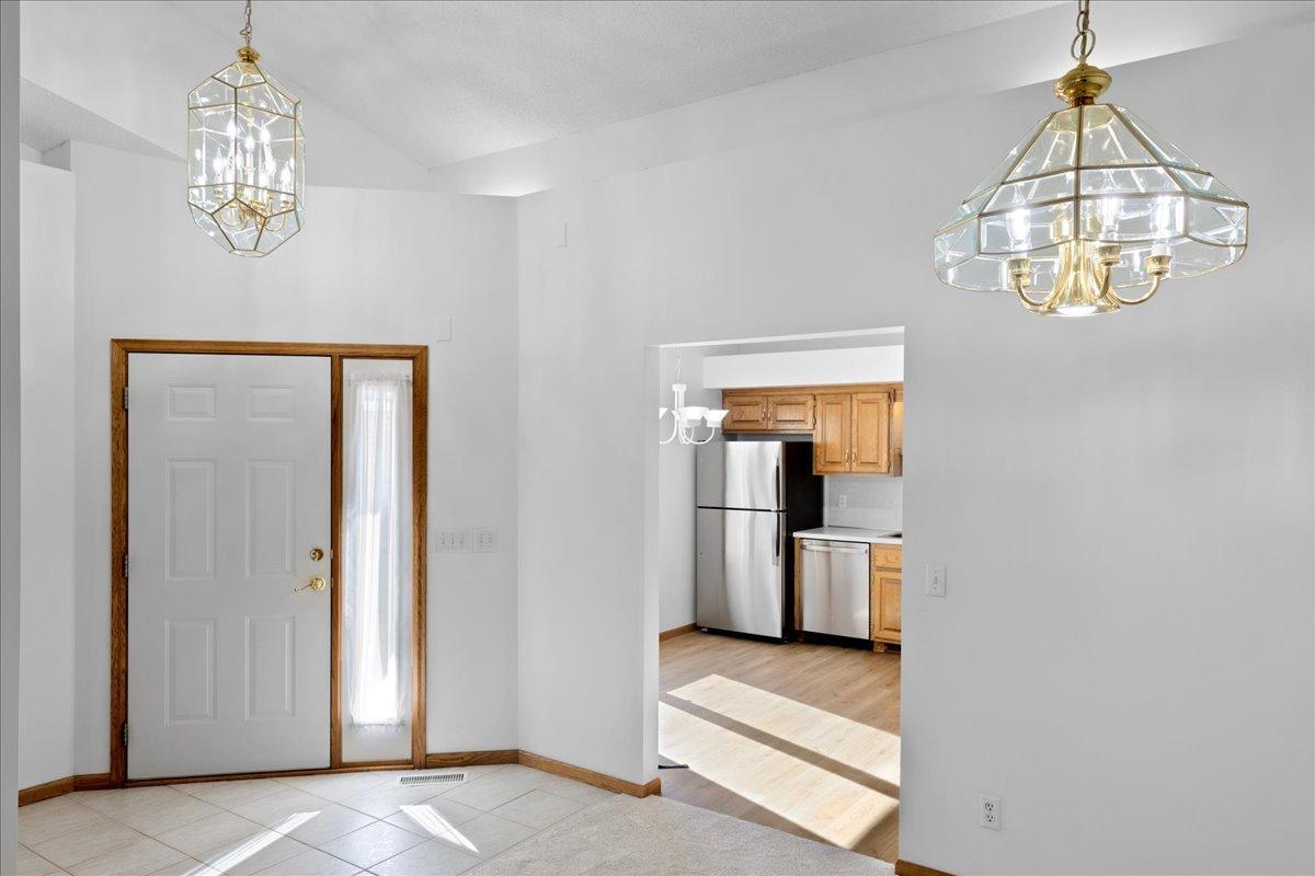Welcome guests in the spacious Foyer with ceramic tile floor and coat closet