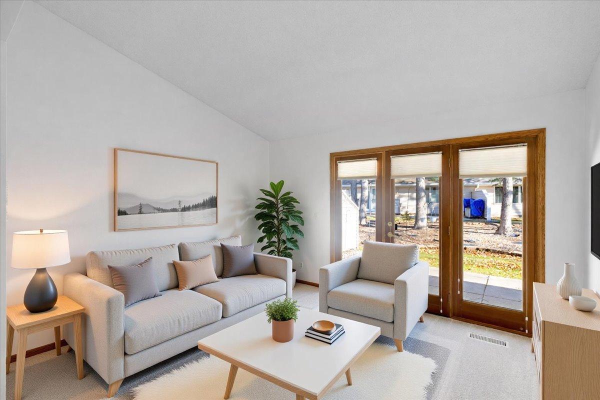 Beautiful Sun Room - the perfect place to cozy up with a book or enjoy your morning cup of coffee - walks out to backyard green space