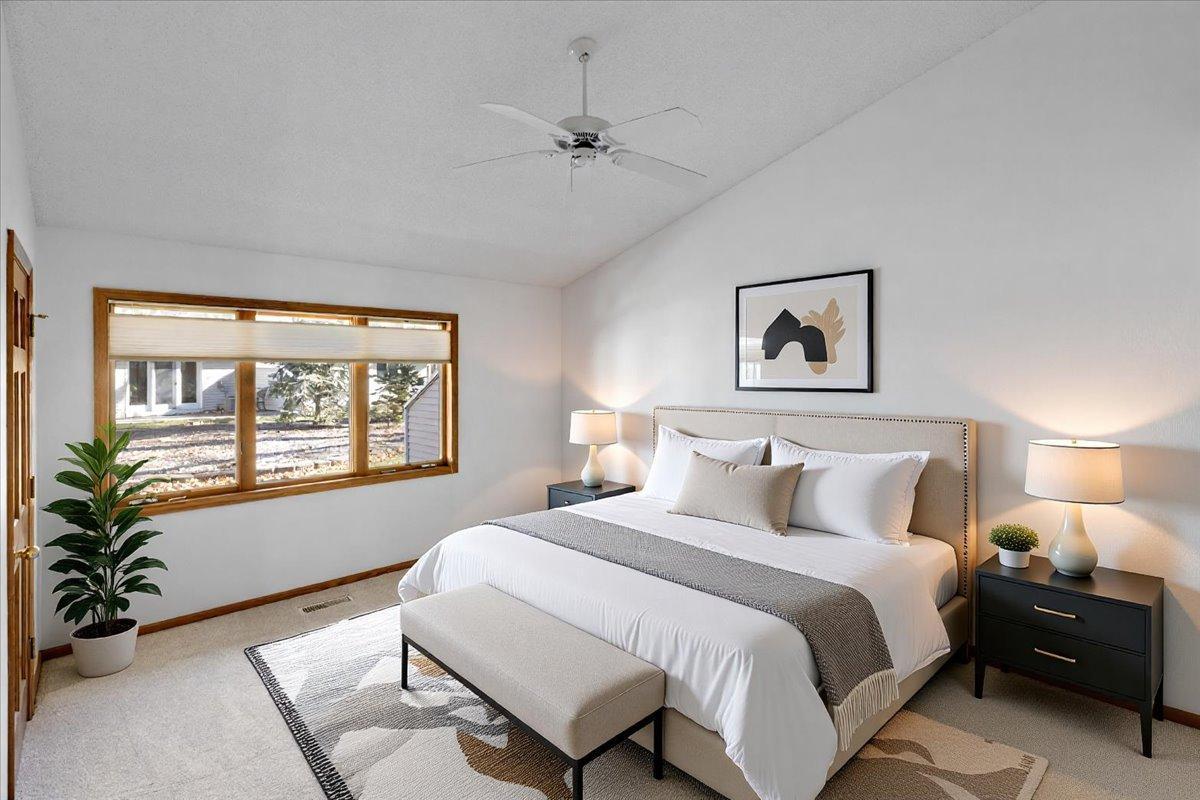 Primary bedroom Suite with vaulted ceiling (virtually staged)