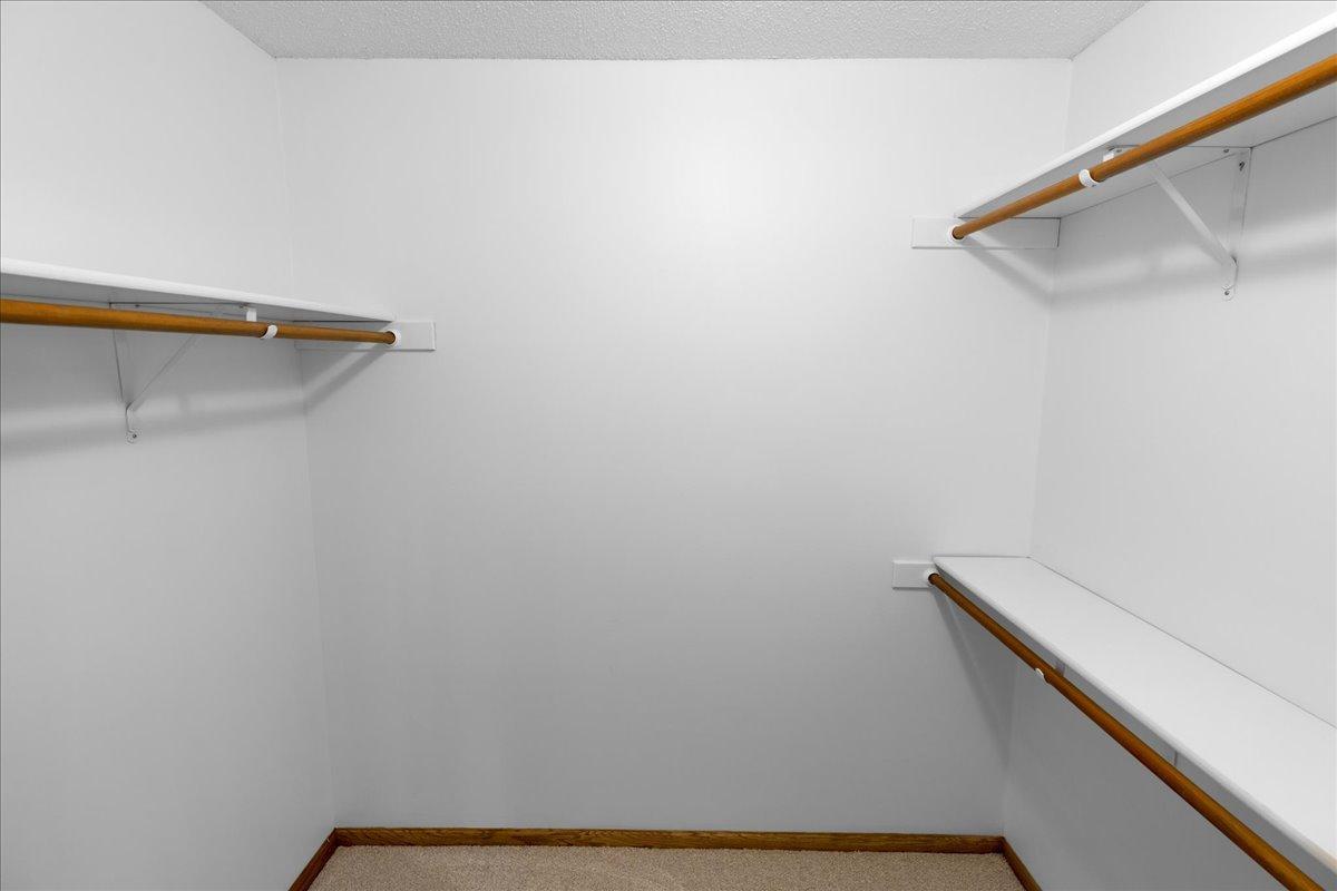 Primary bedroom walk-in closet
