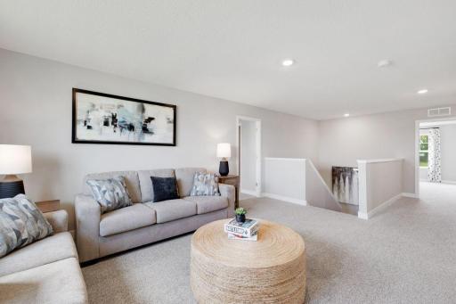 Second living space, anyone? This oversized loft upstairs is the perfect place to binge your favorite shows! Photo of model home, colors and finishes may vary.