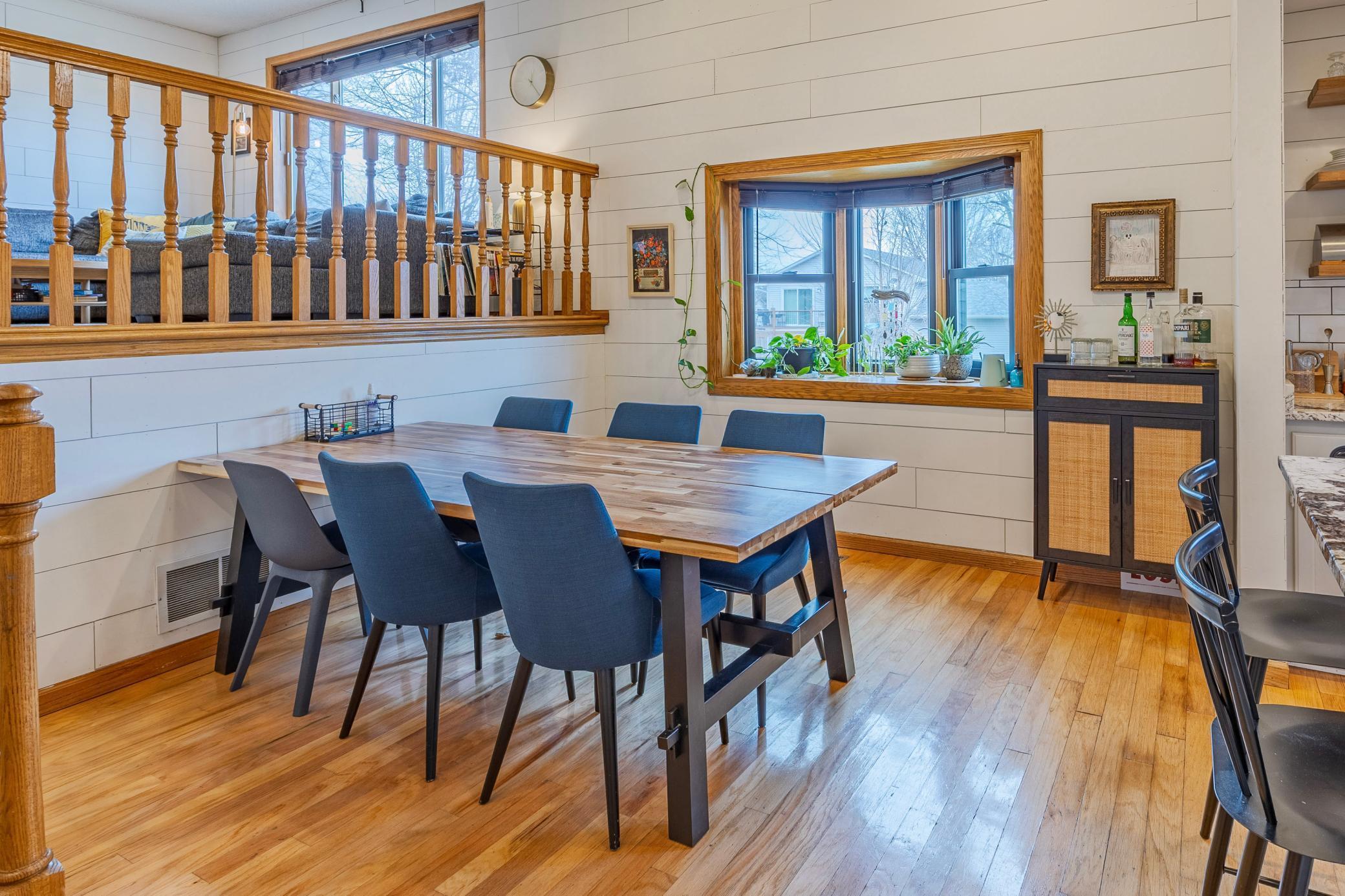 Spacious informal dining room with space on the bay window for your indoor plants, a cat bed or space for the littles to watch the rain/snow fall!
