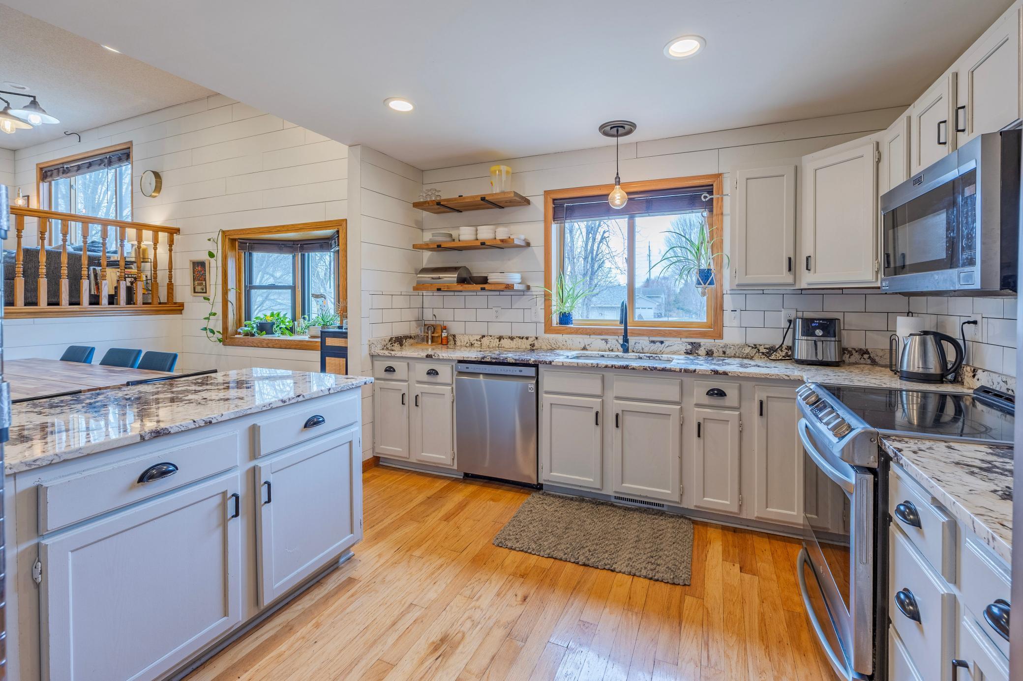 View towards the dining room and upper level living room, from the kitchen.