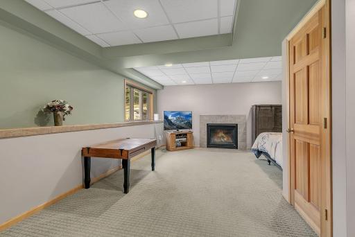 L-Shaped Family Room 11 x 9 and 25 x 11 in Size - Look Out Window Creates a Feeling of Above Ground Living Space