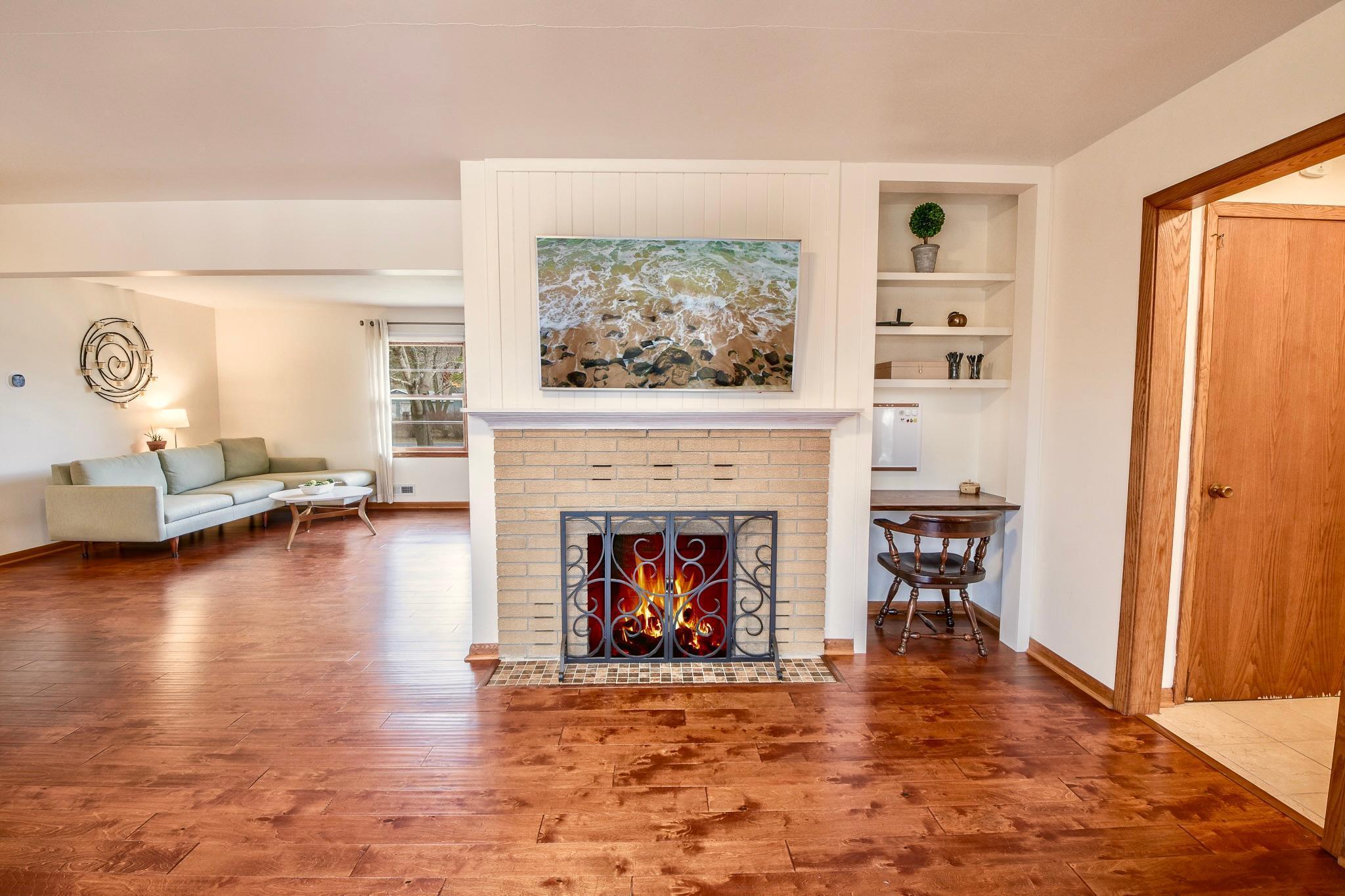 Elegant fireplace centerpiece enhances the room with warmth and style.