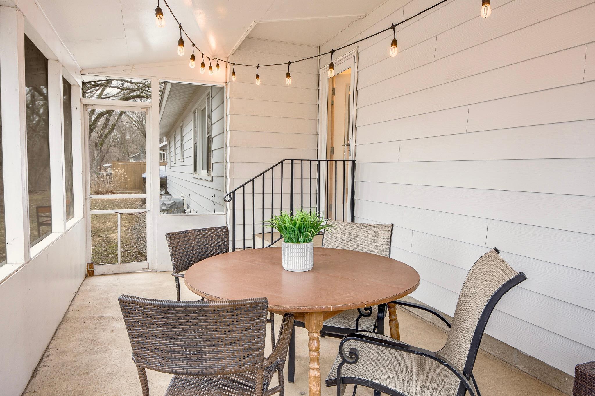 Screened-in porch provides a comfortable outdoor living space.
