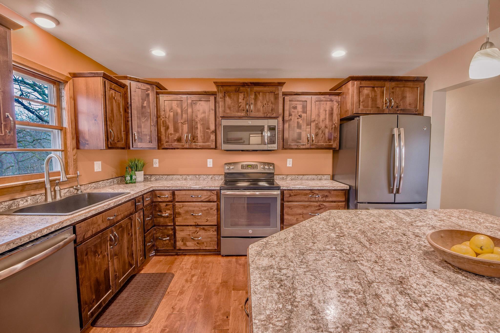 At the center of it all, the kitchen serves as the heart of the home, perfect for everyday living and entertaining.