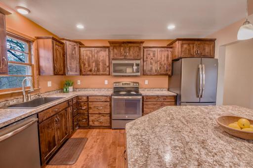 At the center of it all, the kitchen serves as the heart of the home, perfect for everyday living and entertaining.