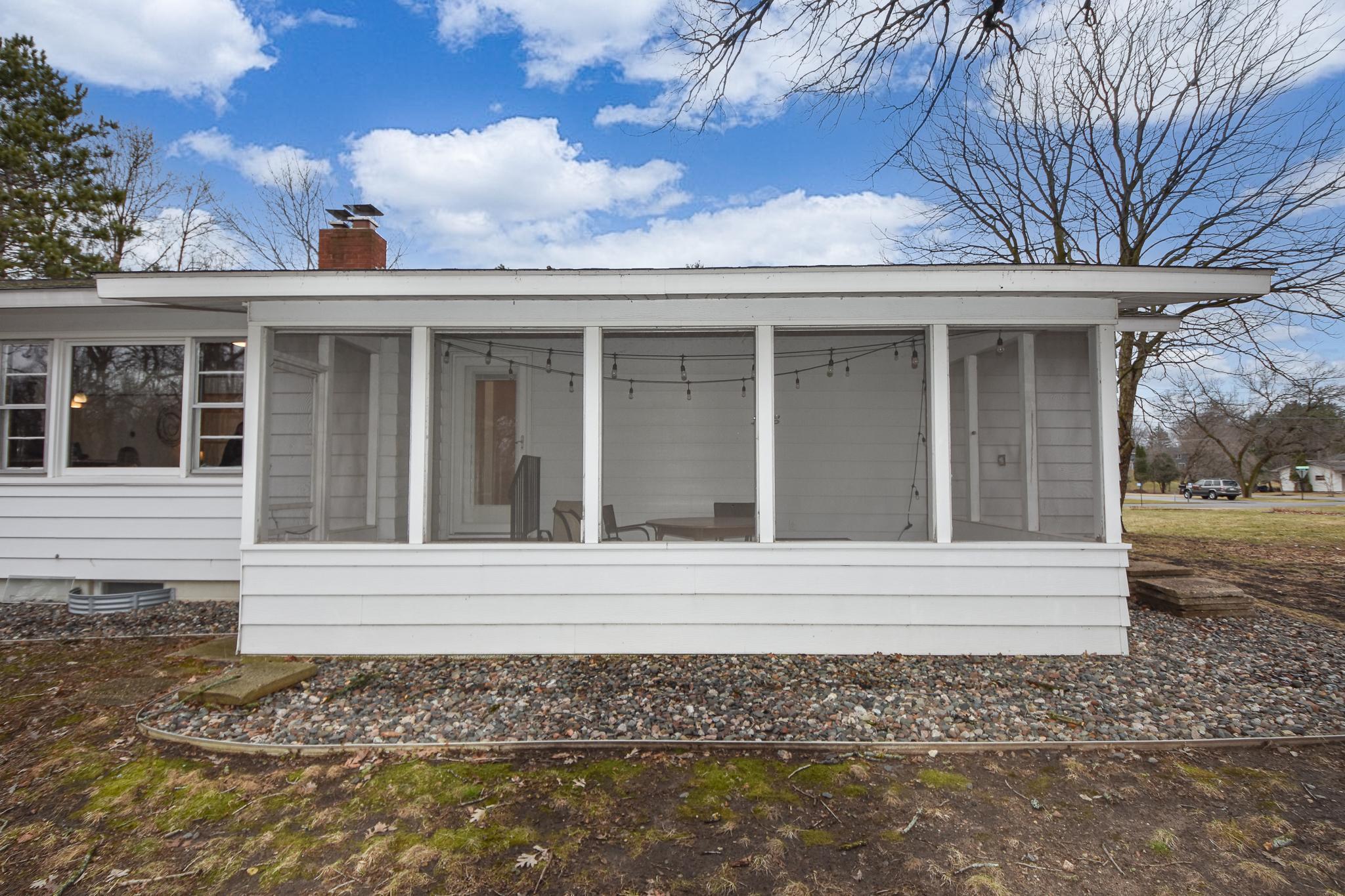 Back of home screened in porch.