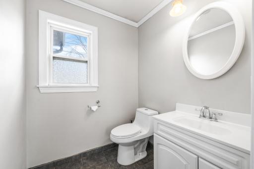 Main level half bathroom with new toilet.