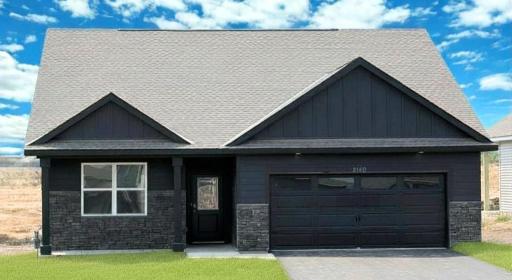Welcome home to the Harmony plan in Bluff View! Stunning curb appeal with board and batten, stone, and cozy front porch. Photo of actual home.