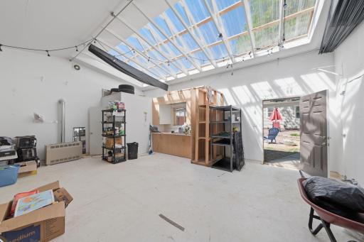 Huge garage/studio space. Add a new door for 2 car garage.