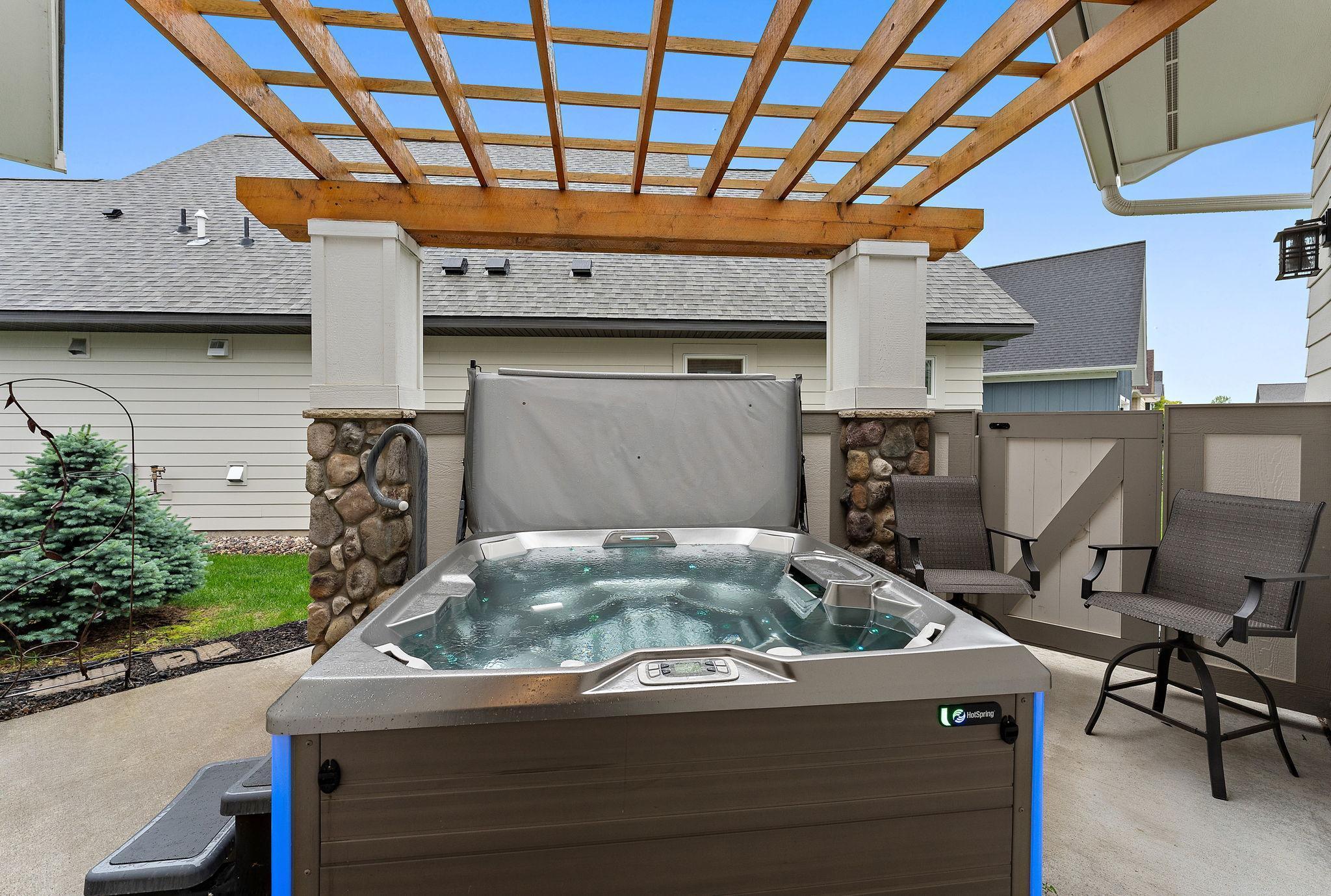 Hot springs with cedar pergola just off the back entry!