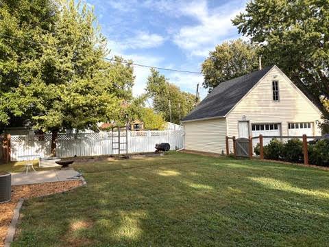 Two car garage has unfinished loft
