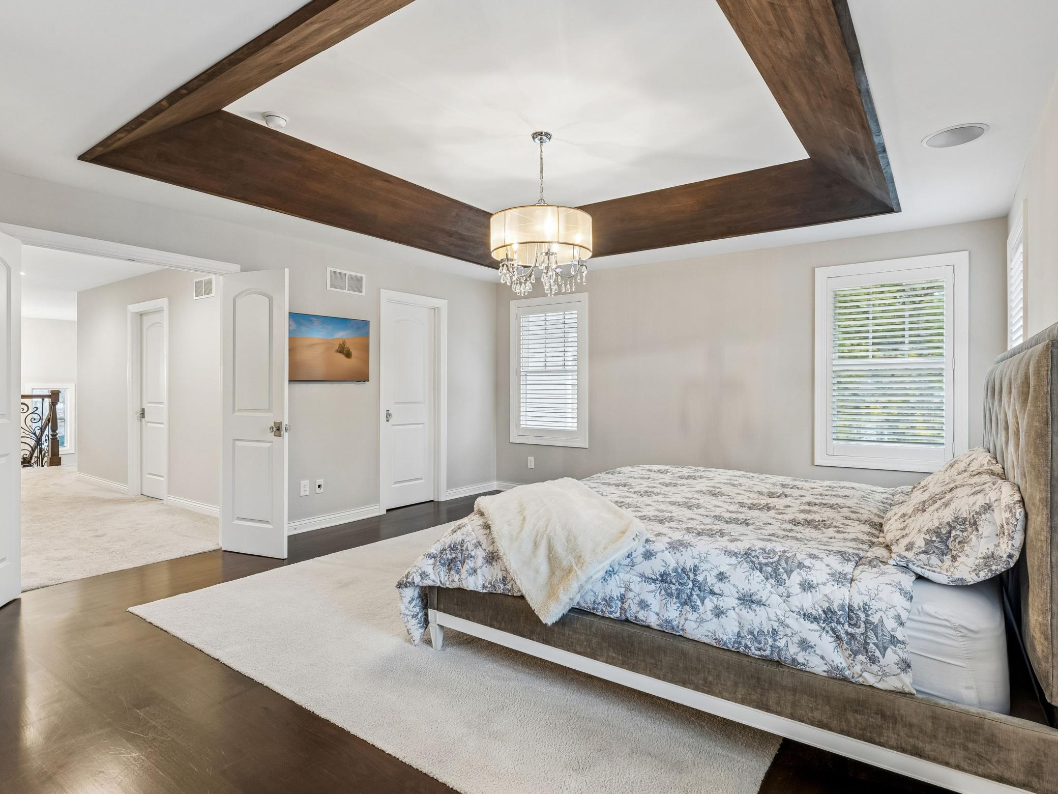 Door on the right is the first closet in the primary suite, door on the left returns you to the hall with the laundry and 3 other bedrooms on the same level