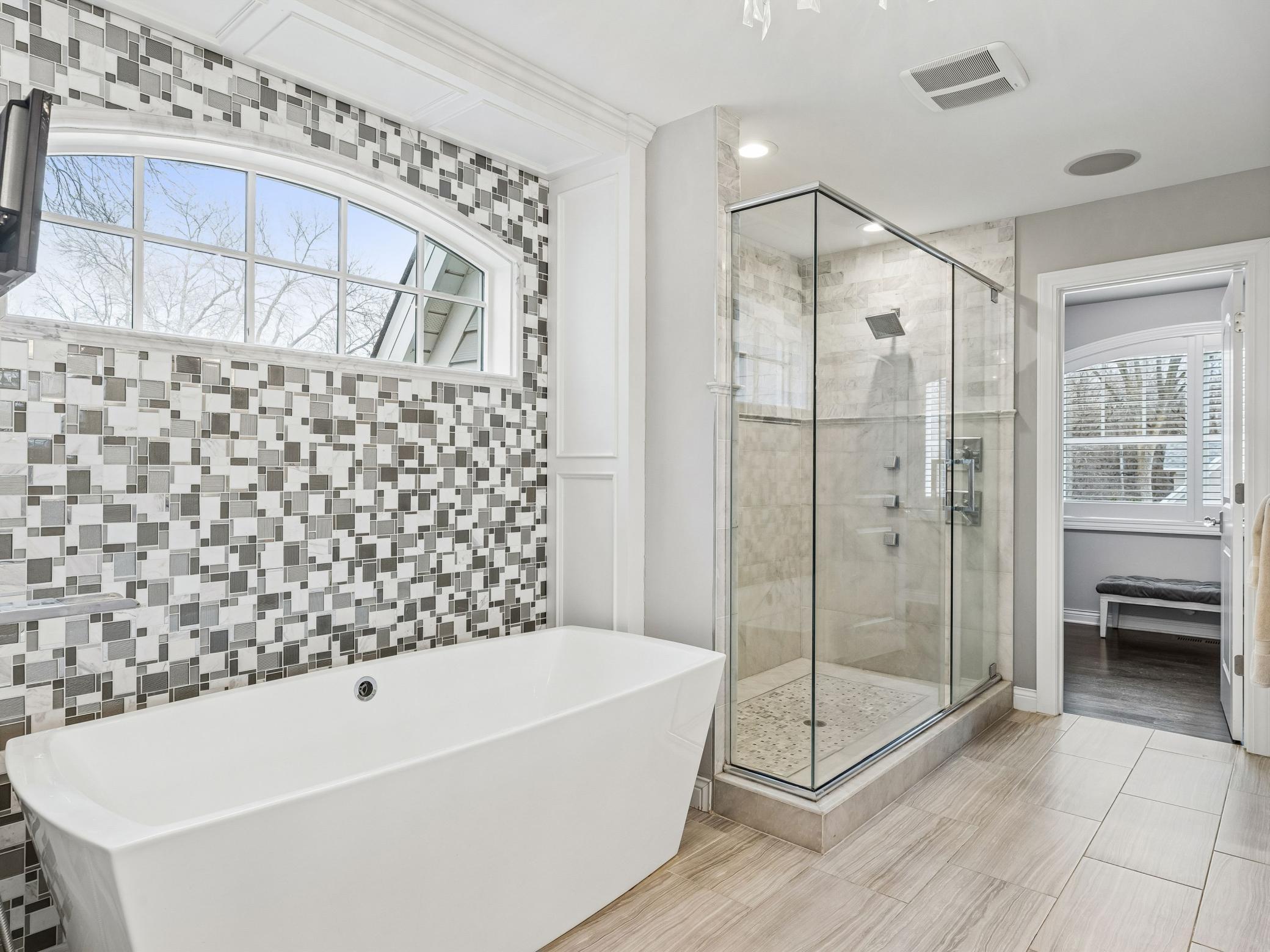 Primary bathroom includes both soaker tub and walk in shower