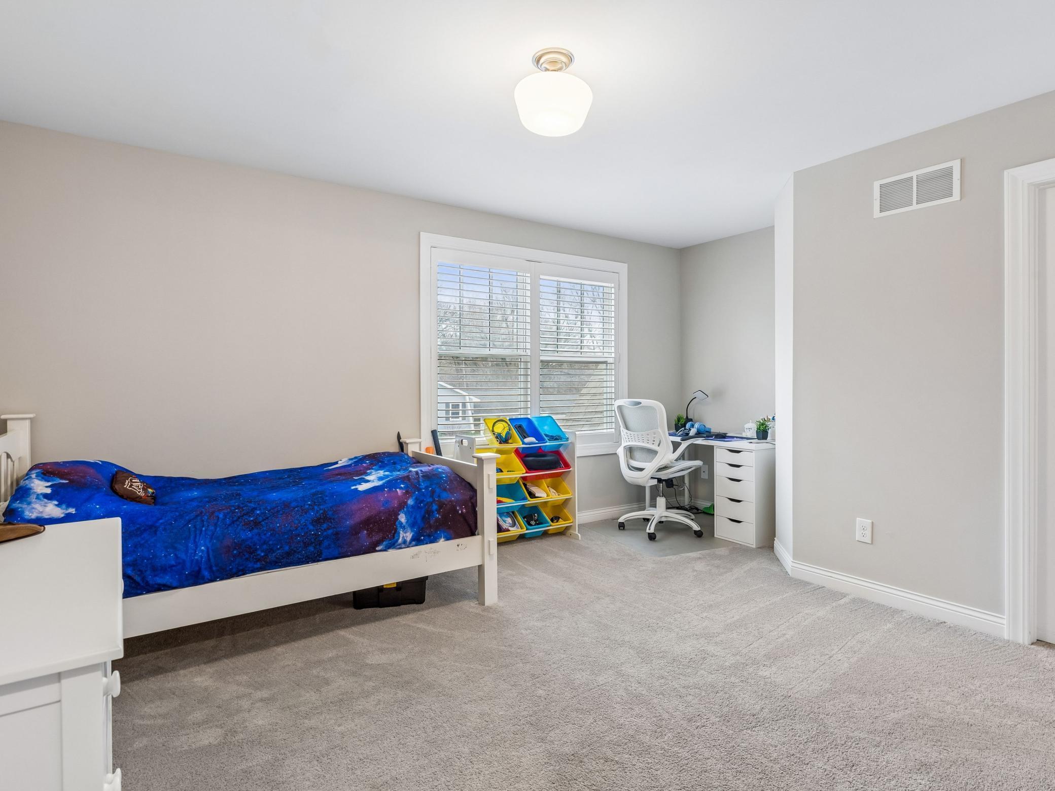 One of four other bedrooms on the upper level.