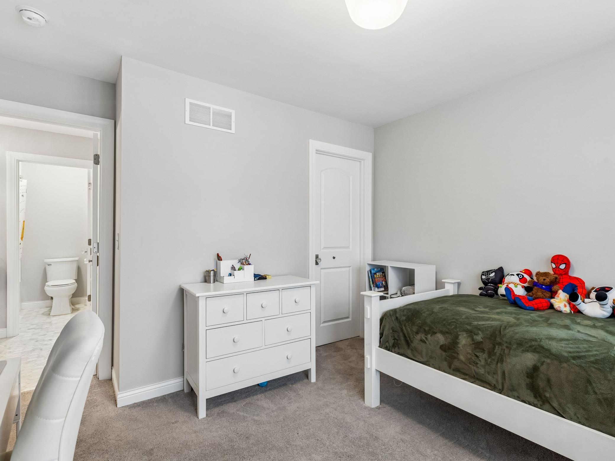Second bedroom. Door to left leads to jack and Jill bathroom, door to right is the closet